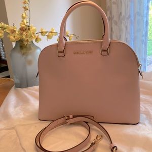 Michael Kors Cindy dome satchel in light pink with gold hardware.